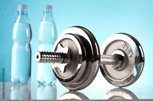 fitness dumbells and bottles of water