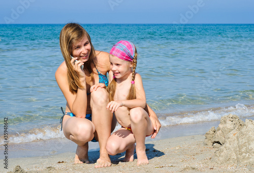 Mother and daughter on the beach