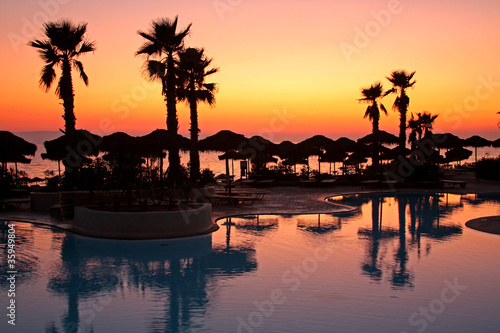 Resort pool at sunset