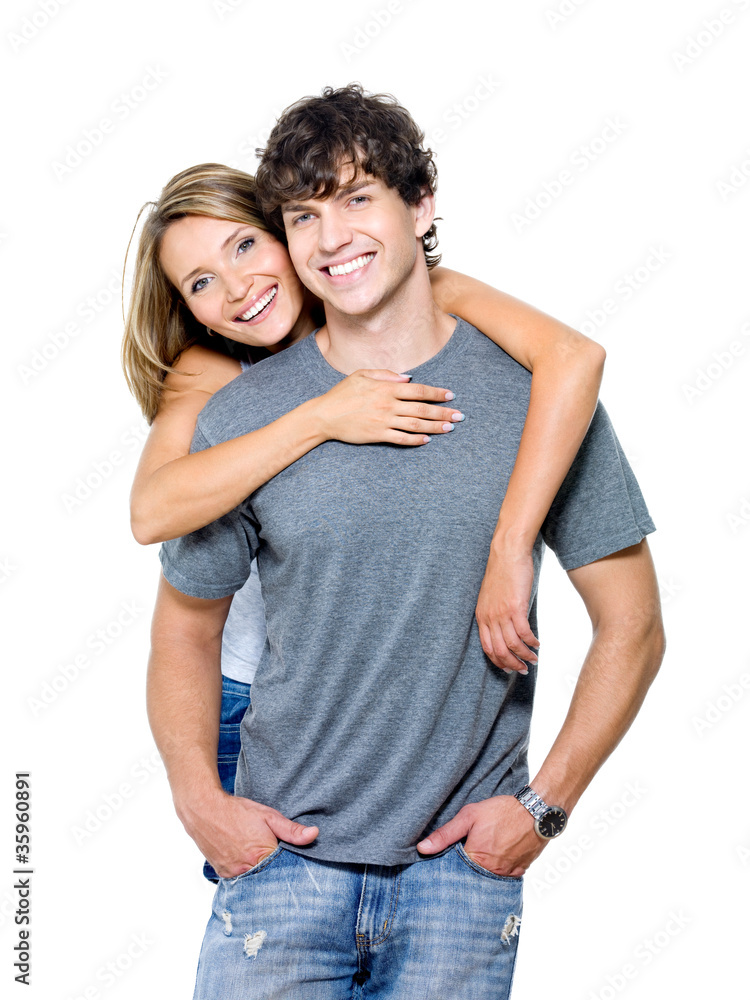 Portrait of young smiling couple on white background Portrait of young smiling couple on white background