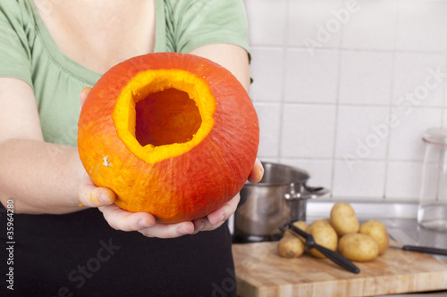 housewife showing hokkaido pumpkin photo