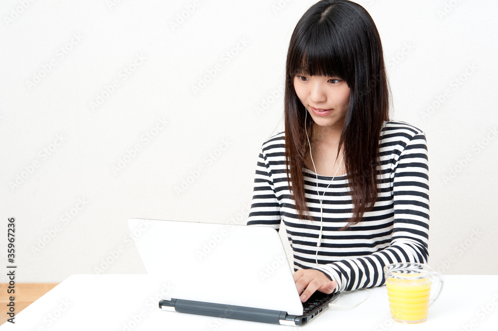 pretty asian woman using laptop pretty asian woman using laptop