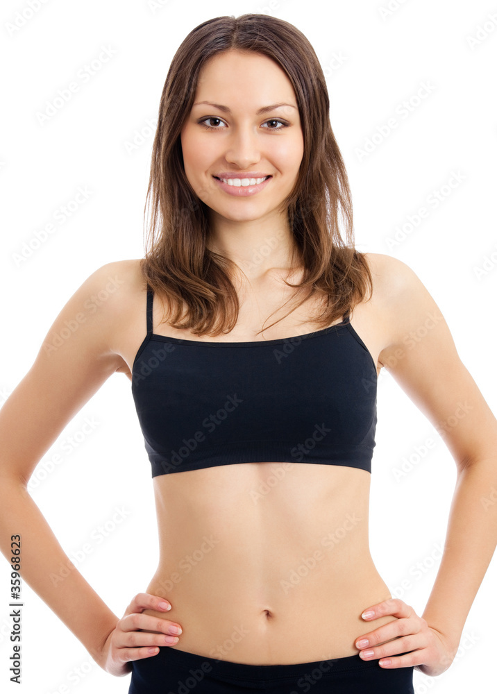 Smiling woman in fitness wear, isolated Smiling woman in fitness wear, isolated