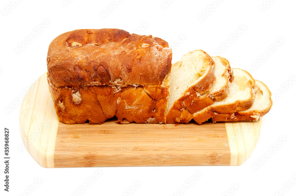 baked sugar bread in closeup on wooden cutting board