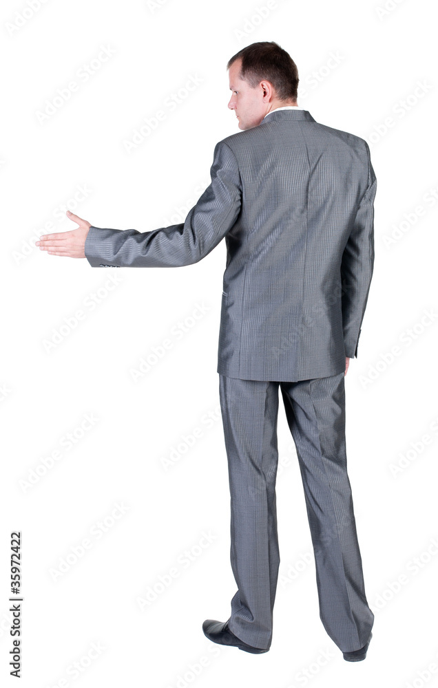 businessman extending hand to shake. Rear view. businessman extending hand to shake. Rear view.