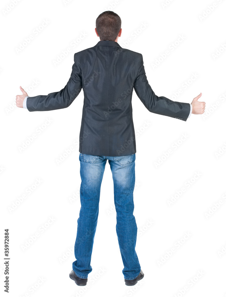 Businessman thumbs up. rear view. Businessman thumbs up. rear view.
