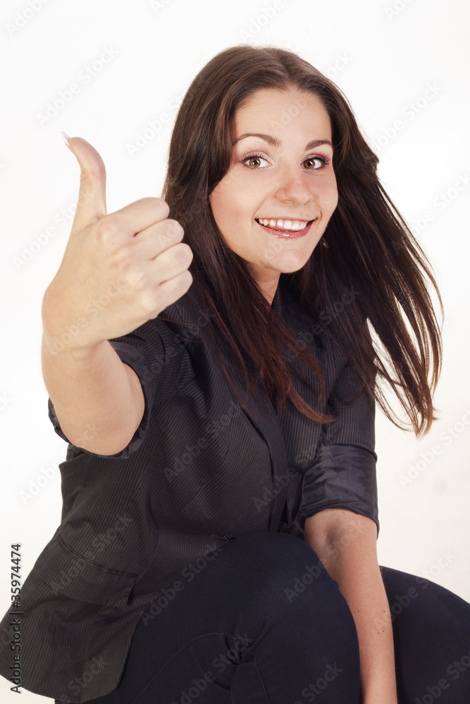 Young businesswoman showing hand ok sign Young businesswoman showing hand ok sign