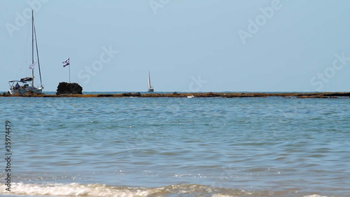 Sailboat moving on a sea photo