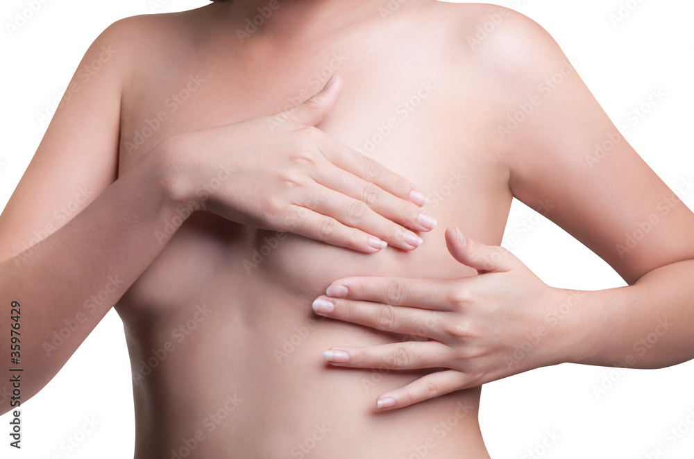 Young Asian adult woman examining her breast for lumps or signs Young Asian adult woman examining her breast for lumps or signs