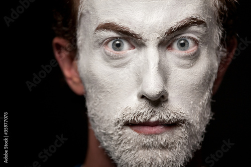 A man with makeup on his face