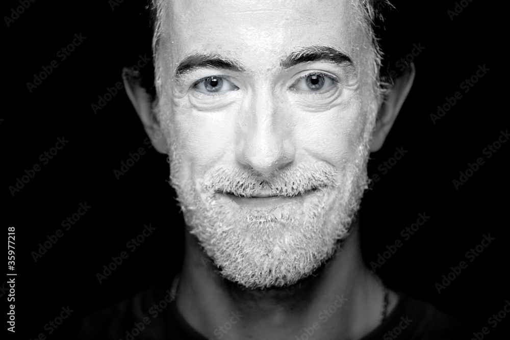 A man with makeup on his face A man with makeup on his face