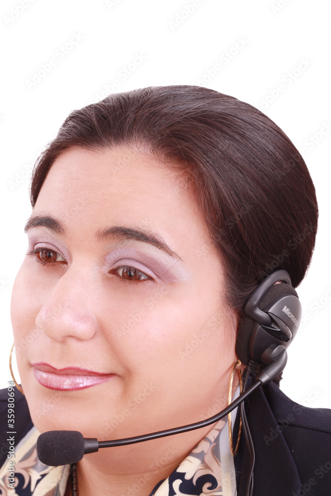 Young beautiful girl in headset,sitting at the desk tired, isola Young beautiful girl in headset,sitting at the desk tired, isola