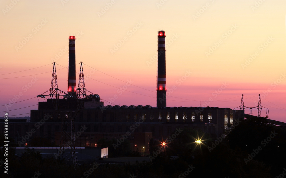 Power station with chimney at evening