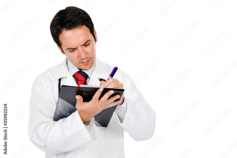 Medical doctor with stethoscope writing notes at notebook . Isol Medical doctor with stethoscope writing notes at notebook . Isol