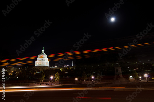 US Capitol building with car lights trails in moonlight