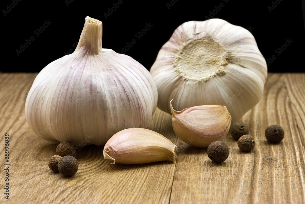 garlic on rough chopping board garlic on rough chopping board
