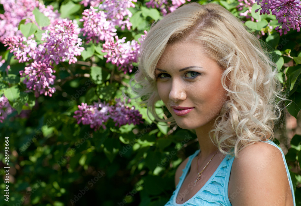 Young blonde woman in the park