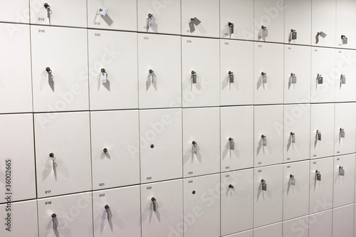 Close-up of white lockers with keys