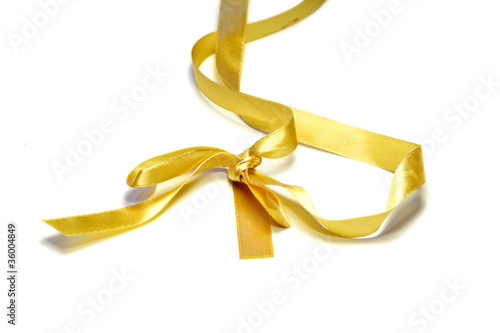 Gold ribbon on white background