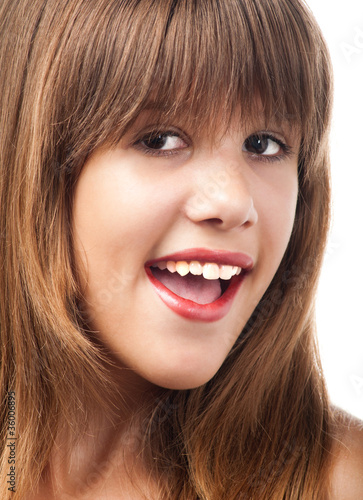 Portrait of the beautiful smiling teenage girl.