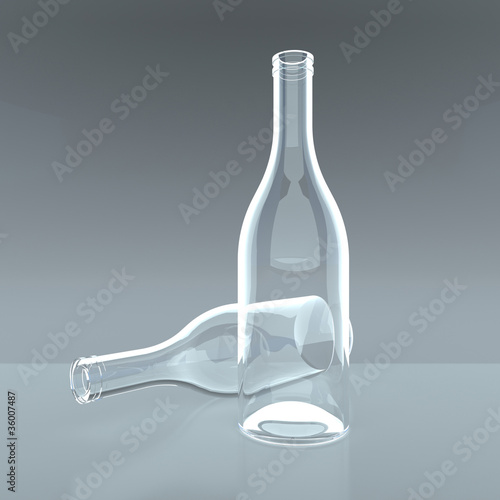 Two empty glass bottles on a grey background