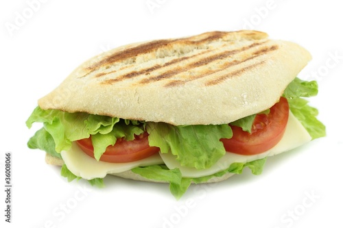 toasted Italian bread with cheese, lettuce and tomato sandwich