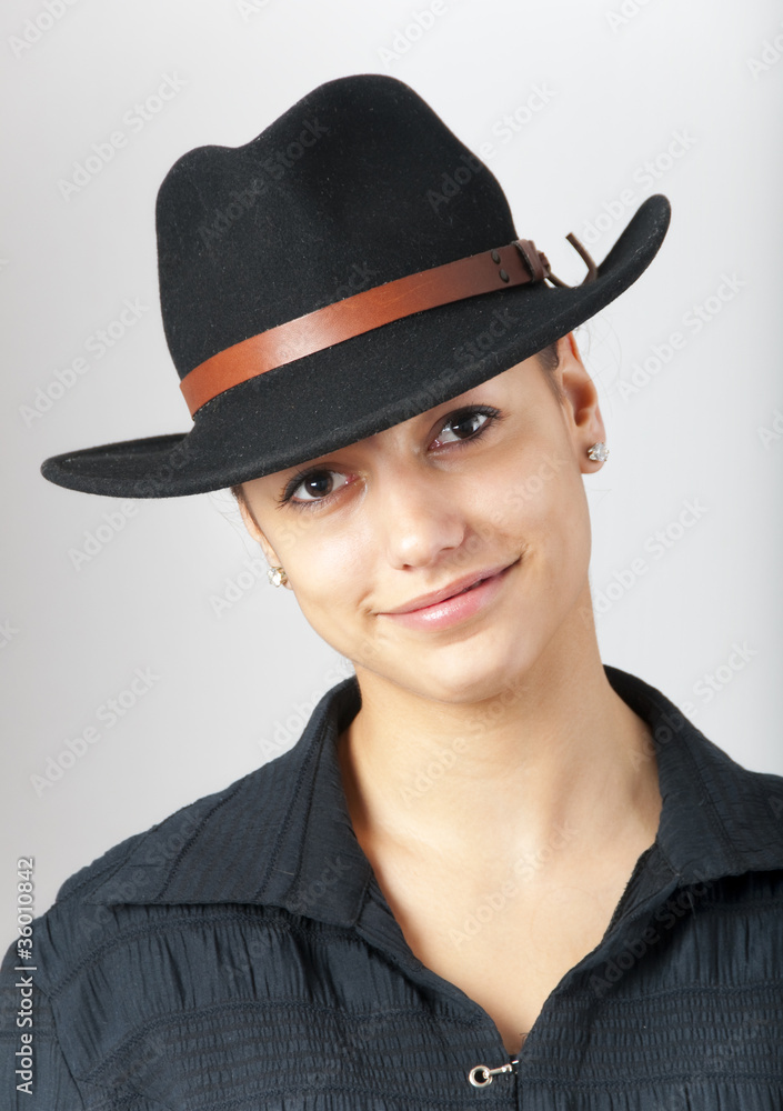 Portrait of the beautiful girl wearing cowboy hat Portrait of the beautiful girl wearing cowboy hat