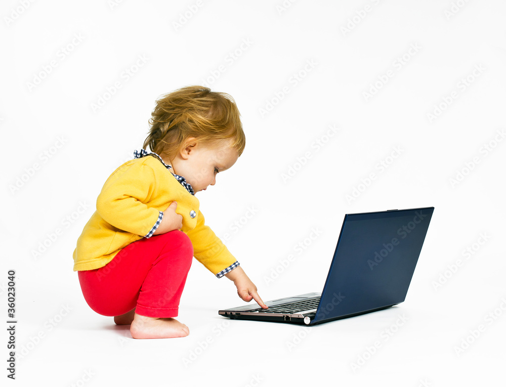 Cute little girl with blue laptop isolated on white background Cute little girl with blue laptop isolated on white background
