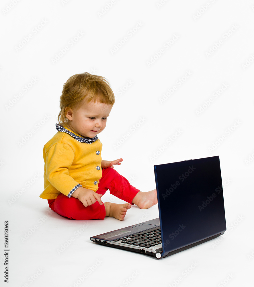 Cute little girl with blue laptop isolated on white background Cute little girl with blue laptop isolated on white background