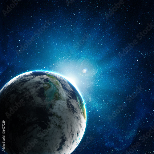 Fototapeta Naklejka Na Ścianę i Meble -  blue earth in space with rising sun