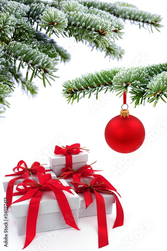 Christmas tree over  gift with red ribbon
