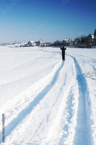 Ski track on snow field in beautiful sunny day