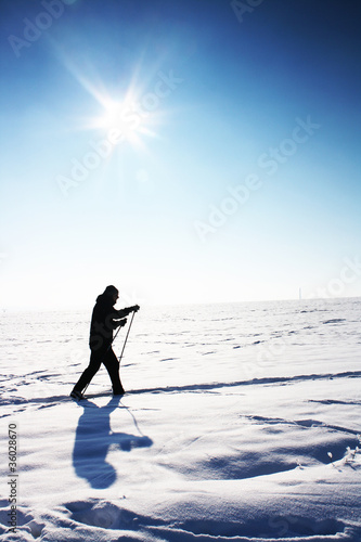 Ski track on snow field in beautiful sunny day