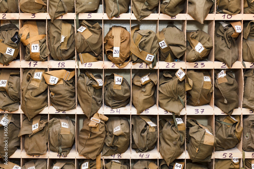 Billede på lærred Background from folded gas masks in cells. Ready for use