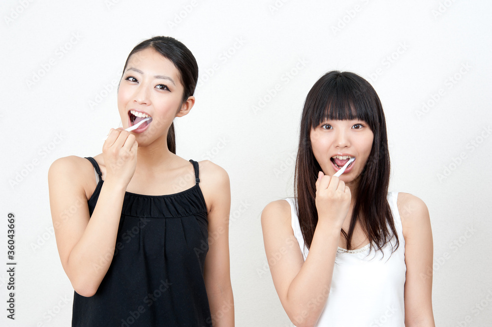 attractive asian women brushing her teeth attractive asian women brushing her teeth