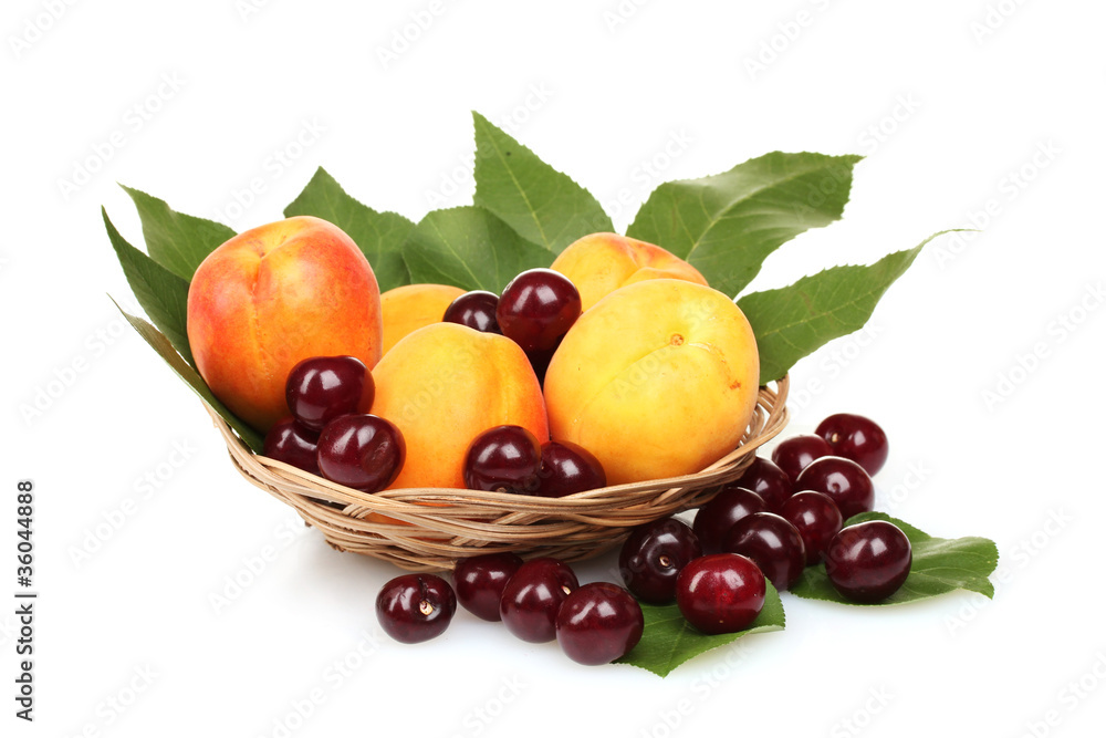 tasty summer fruits in backet isolated on white tasty summer fruits in backet isolated on white