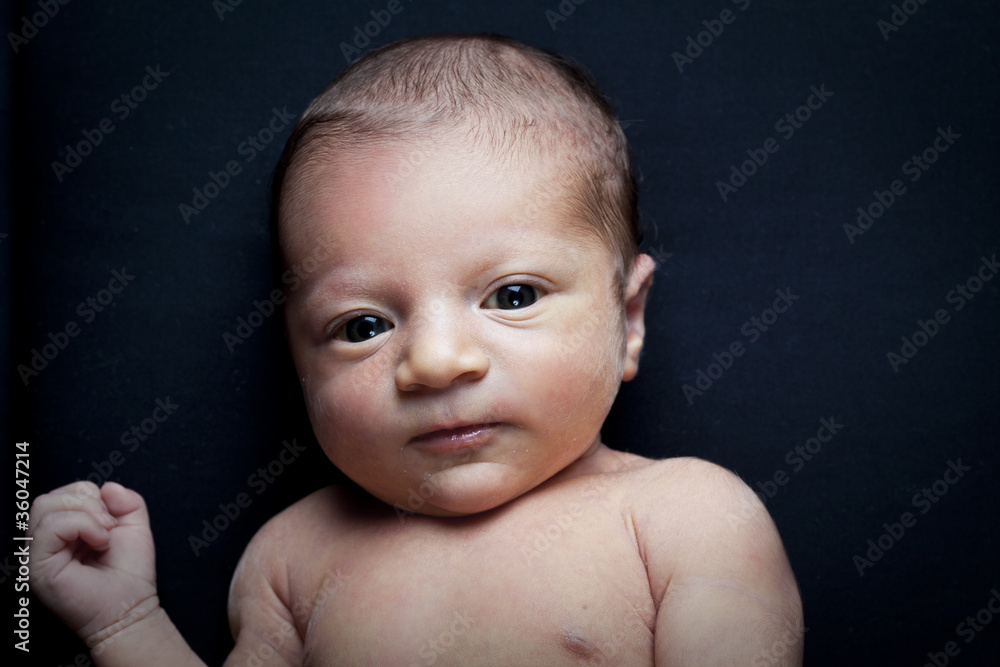portrait of adorable newborn baby girl on black background portrait of adorable newborn baby girl on black background