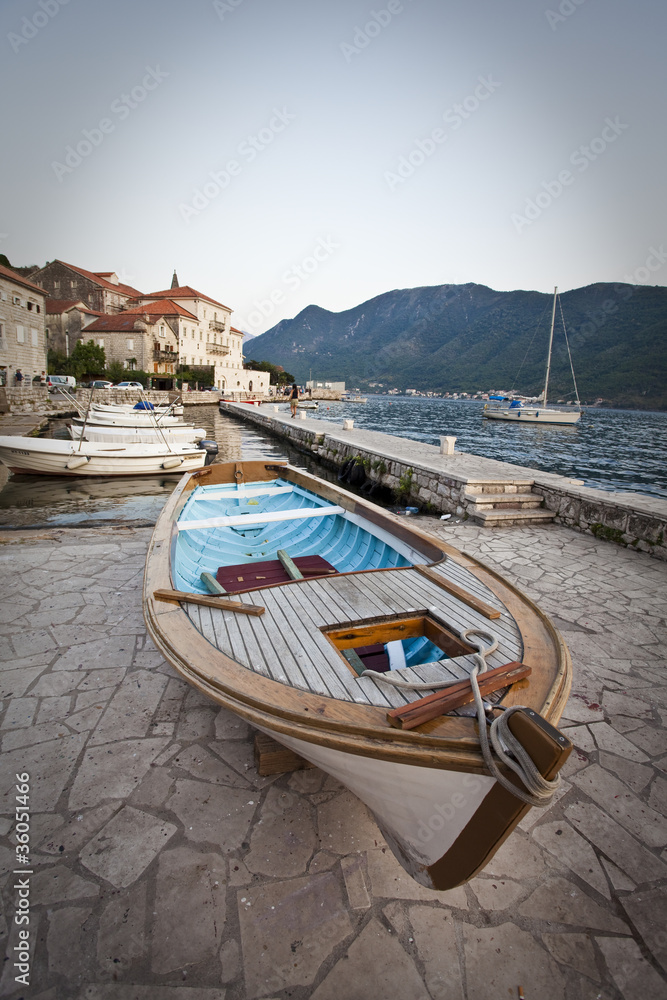 Naklejka premium fishing boat in kotor bay, montenegro