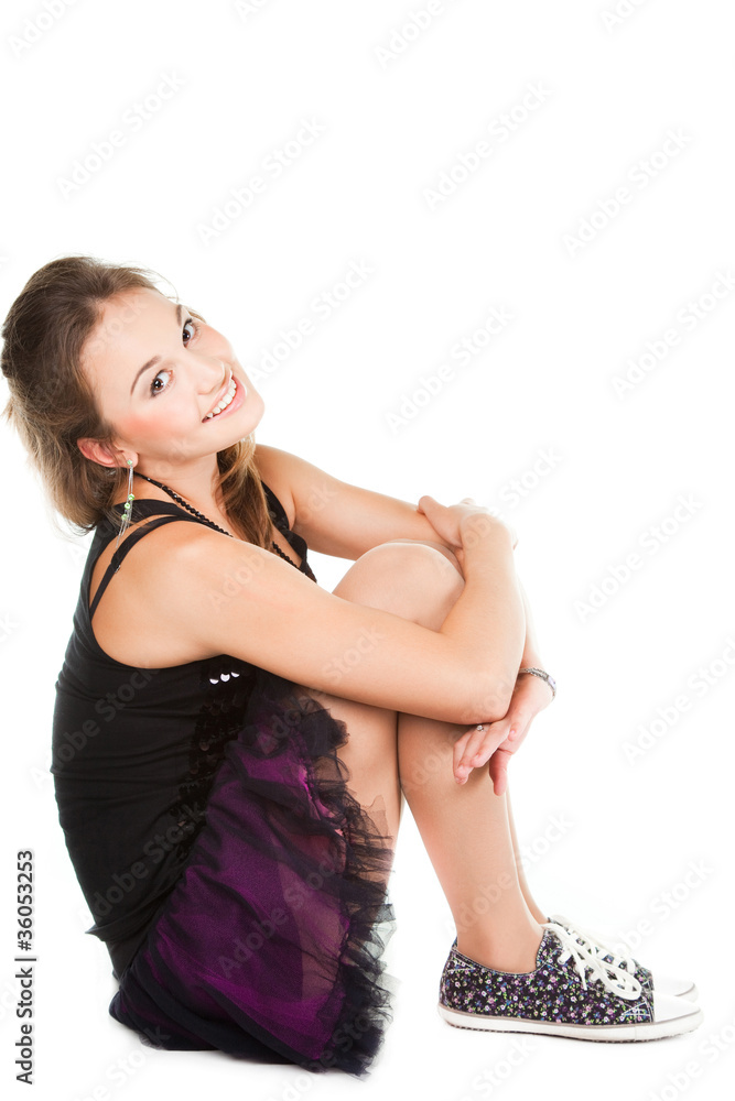 Fototapeta premium Beautiful girl dancer sitting on the floor