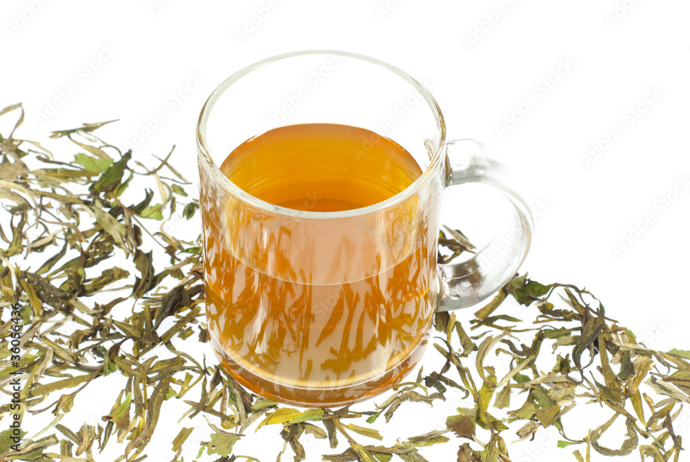 tea in glass cup and dried leaves tea in glass cup and dried leaves