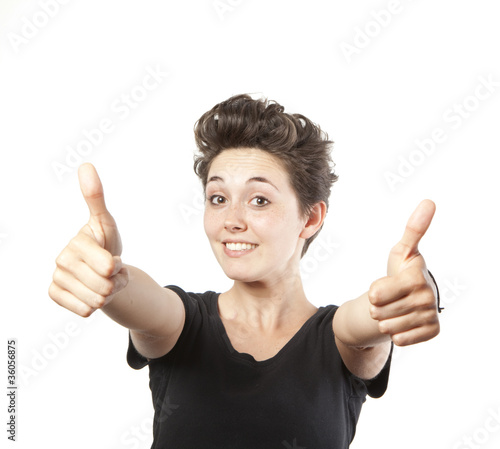 Happy smiling girl with thumbs up gesture, isolated on white bac © Tommaso Lizzul