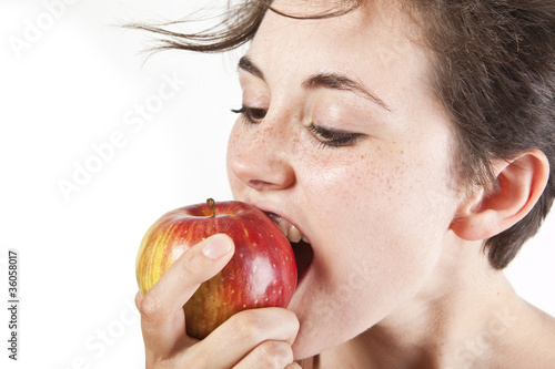 Portrait of beautiful girl with an apple