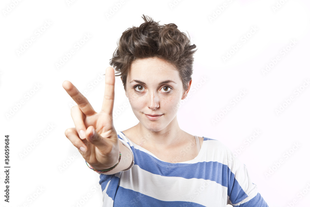 beautiful young girl making a victory sign isolated over white b beautiful young girl making a victory sign isolated over white b