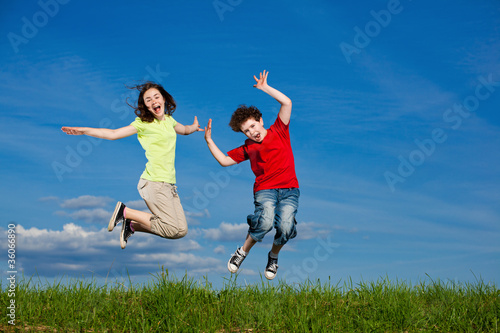 Girl and boy running  jumping outdoor