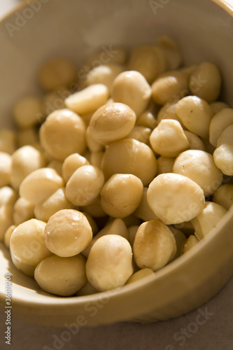 Closeup on raw macadamia nuts in a bowl