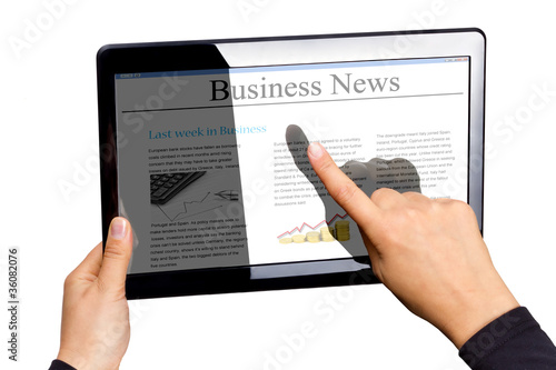 Touchpad with business news isolated on white