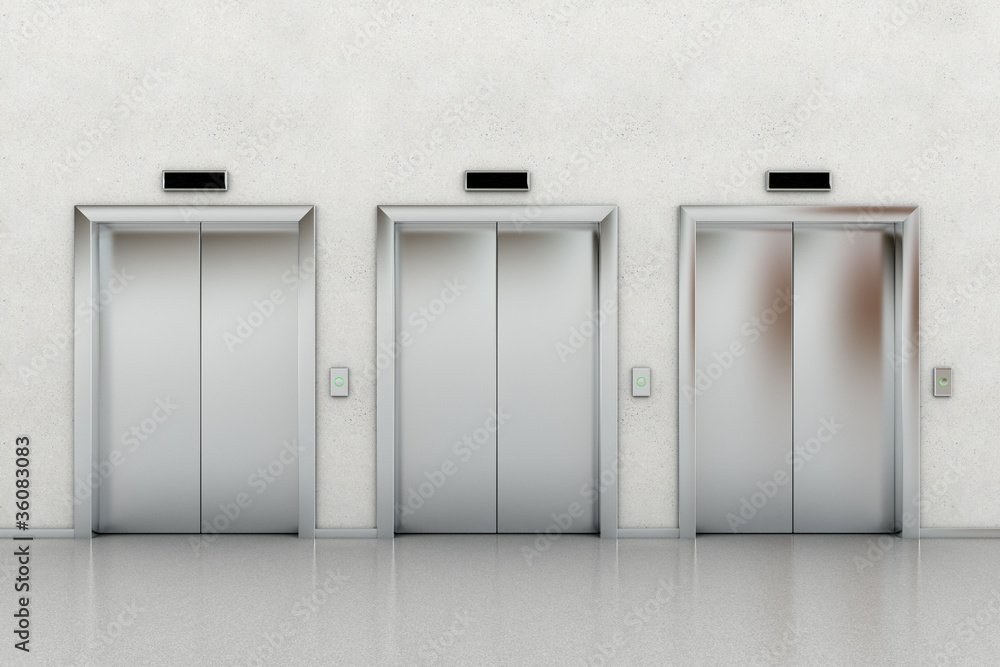 Three closed elevators in a business lobby Three closed elevators in a business lobby