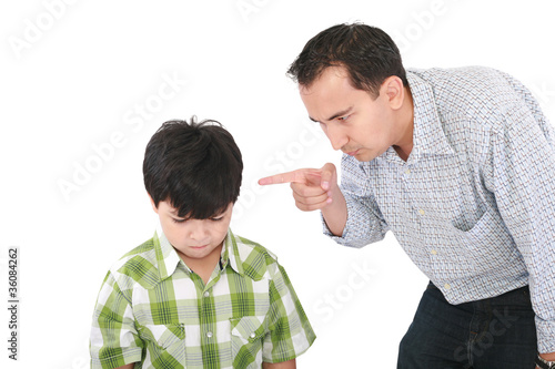 A father is threatening his little boy with a finger