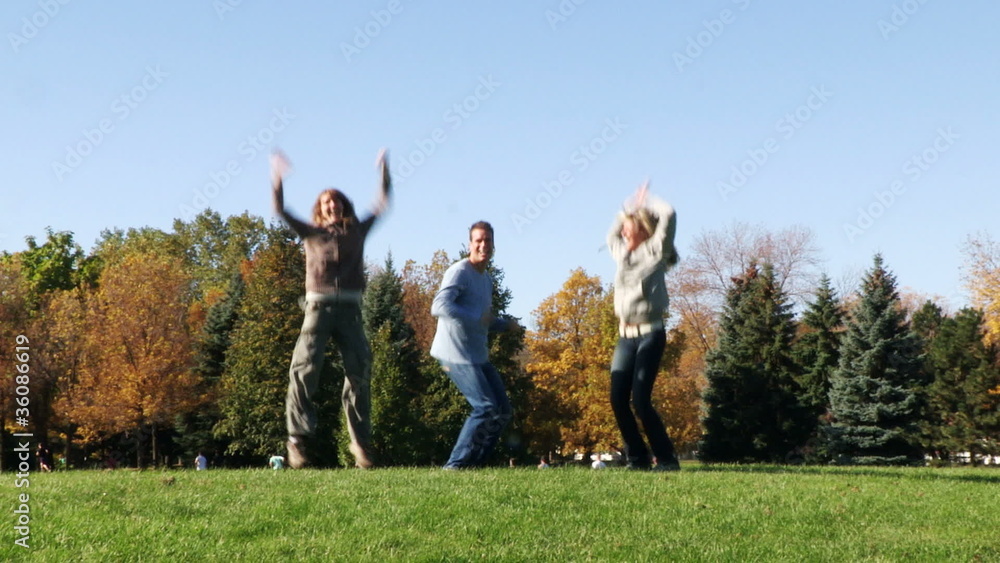 Young happy people jumping under blue sky Young happy people jumping under blue sky