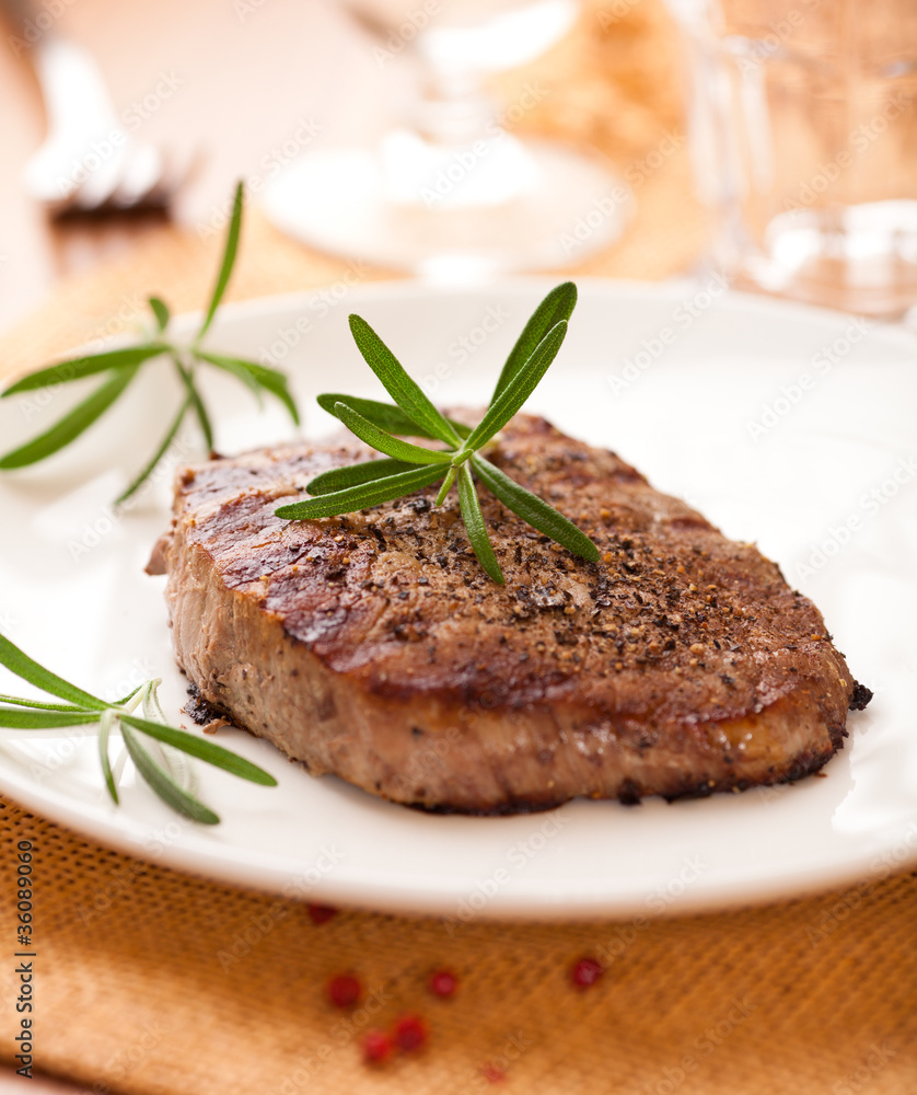 Grilled beefsteak with rosemary and peppercorns Grilled beefsteak with rosemary and peppercorns